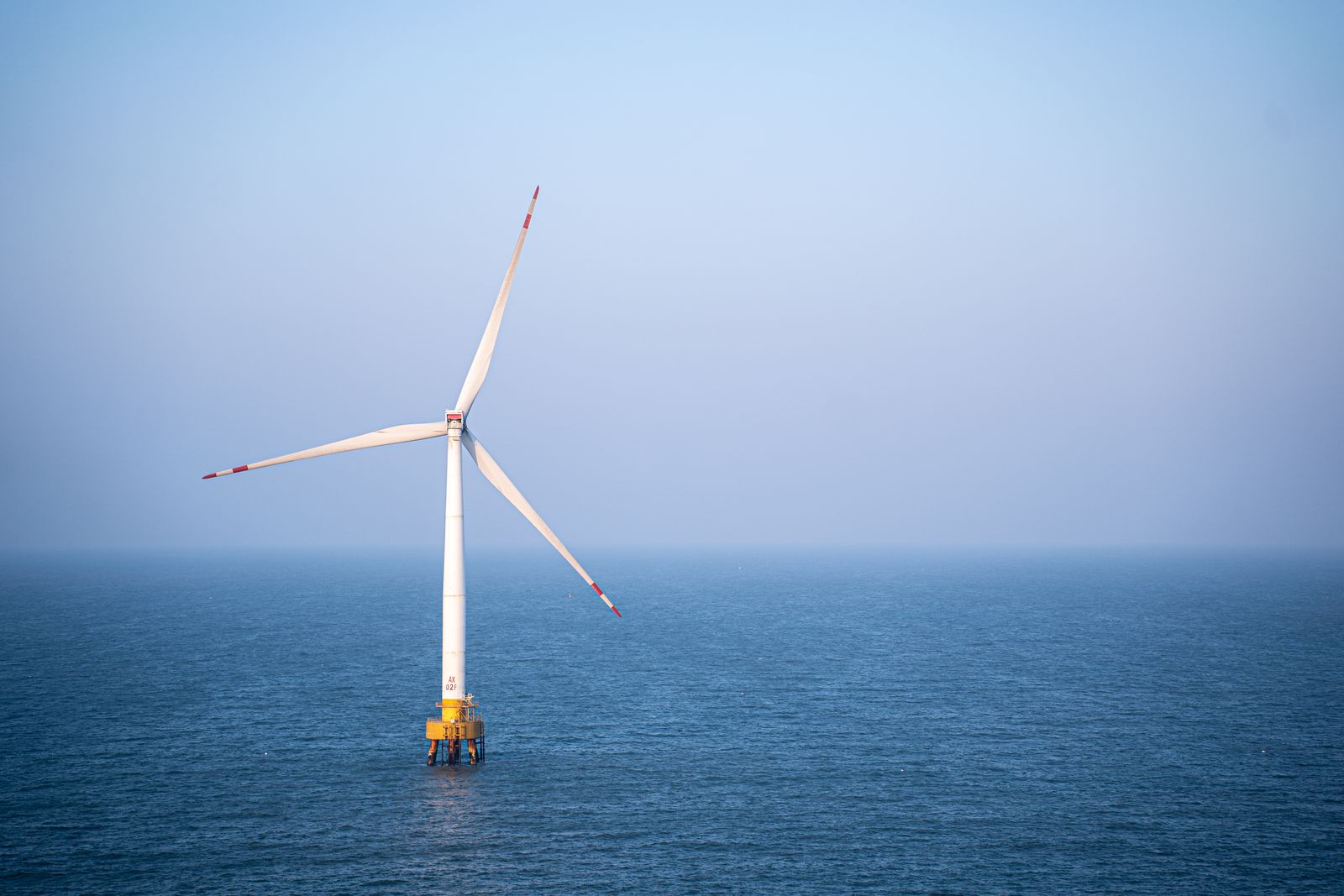 An offshore wind turbine standing in open sea
