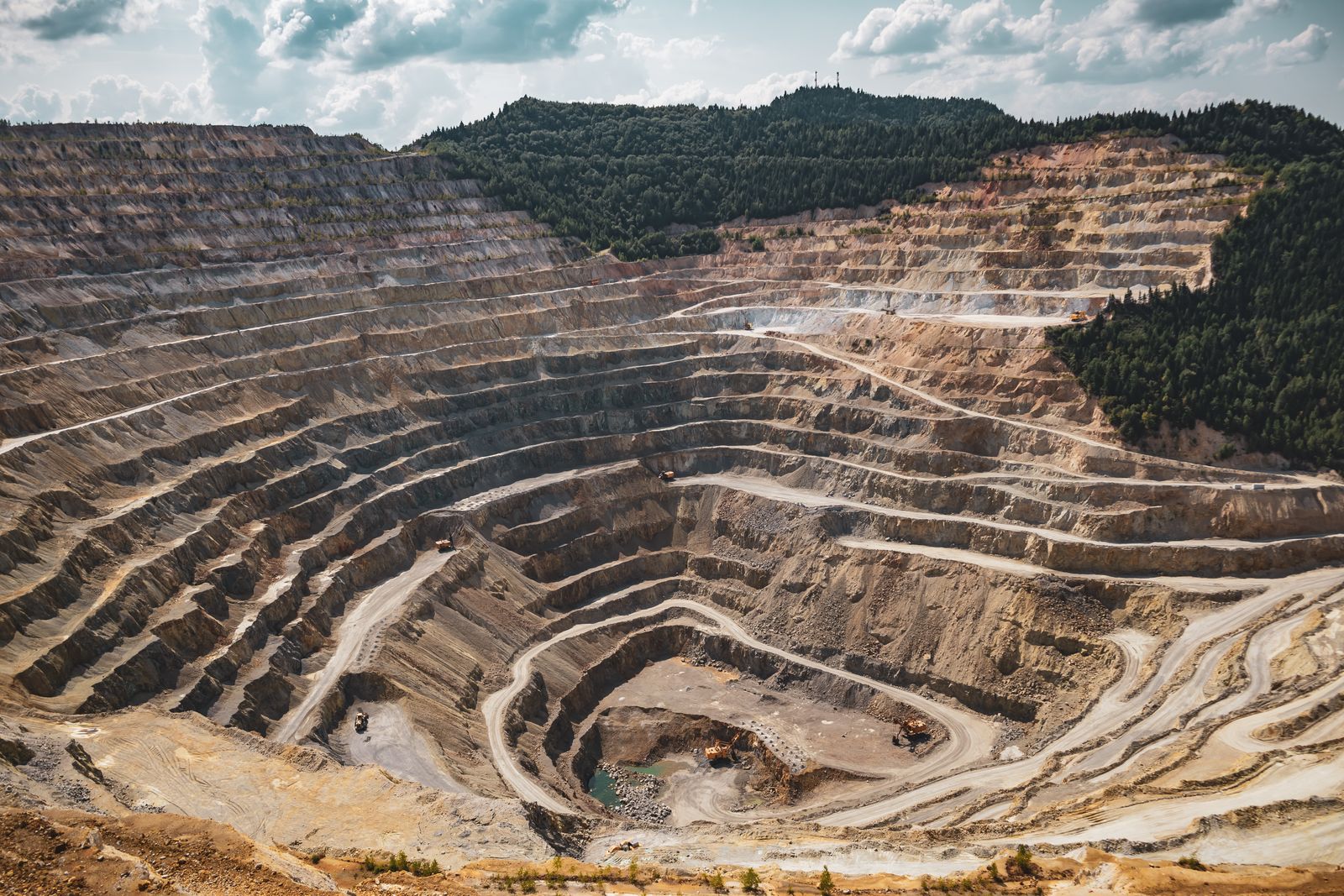Aerial view of a terraced open-pit mine