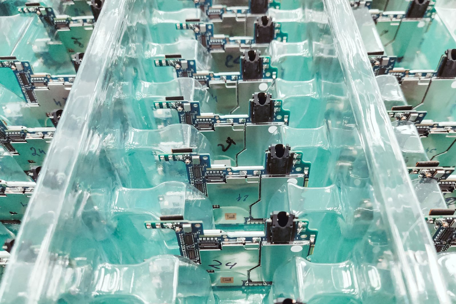 Rows of circuit boards on an electronics production line